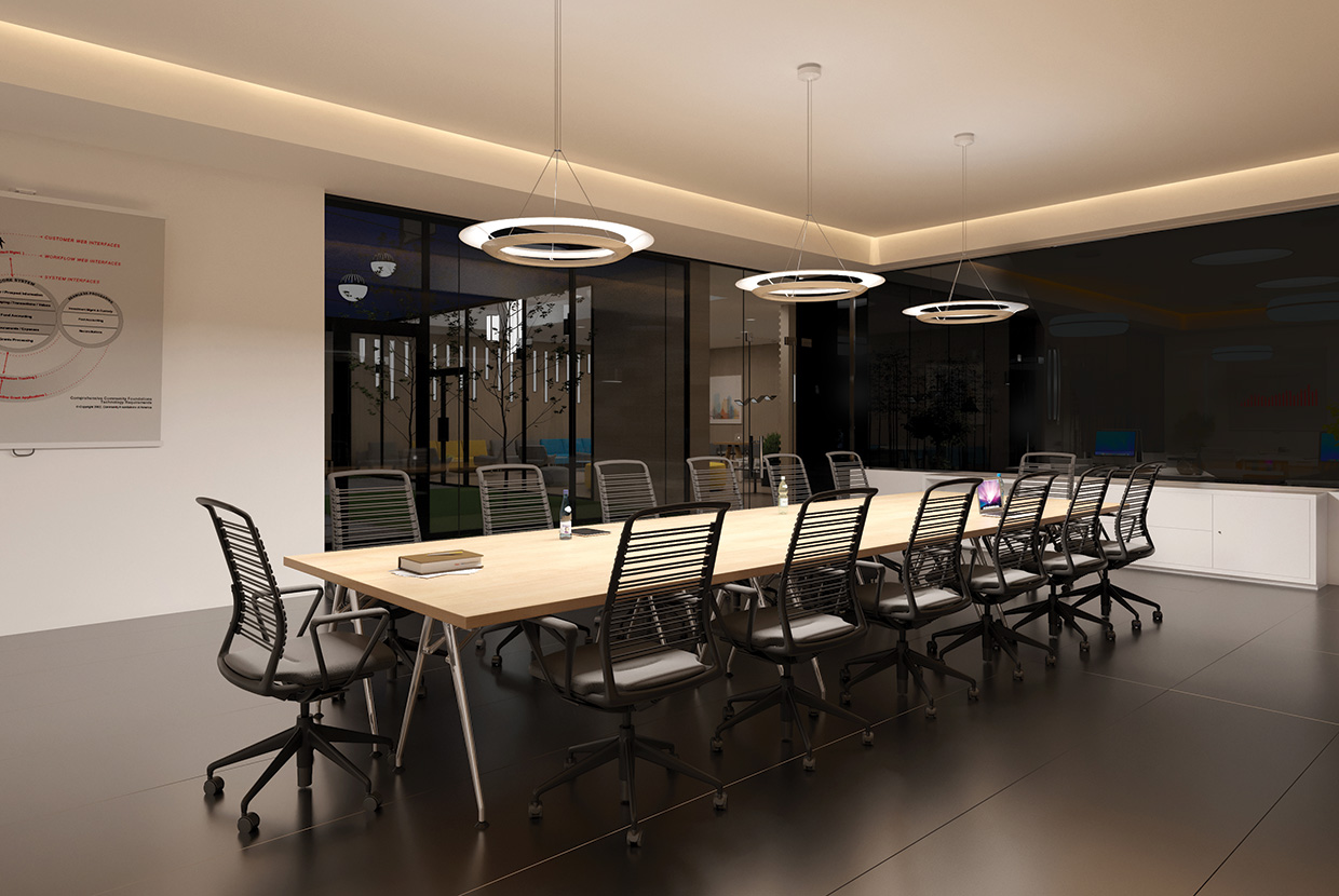 3 ring pendant lights over conference room table in tech office space
