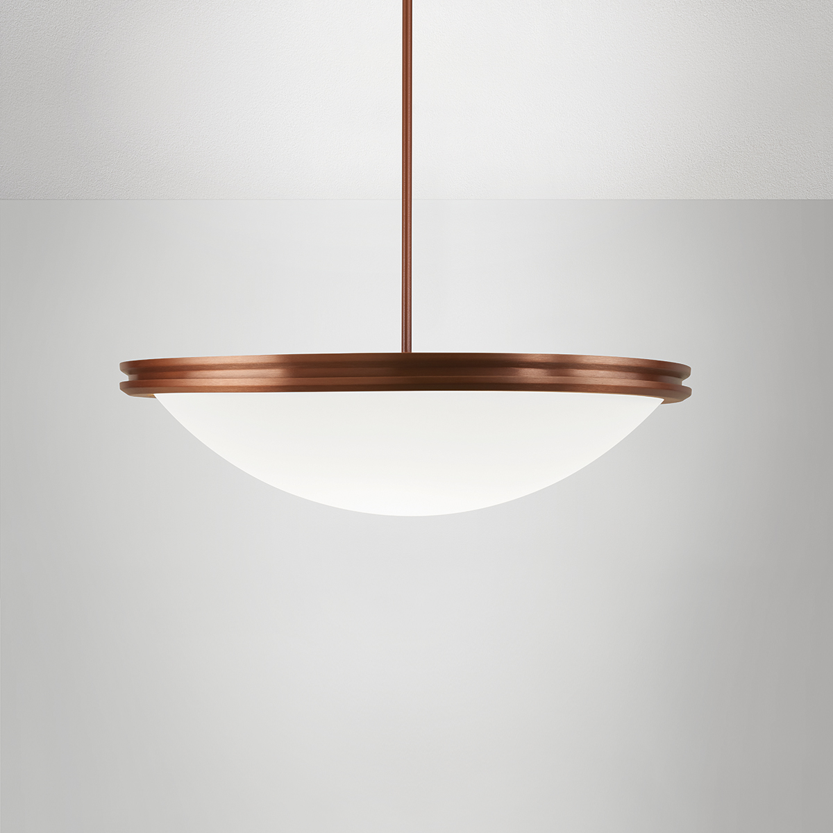 A large bowl pendant suspended with a stem