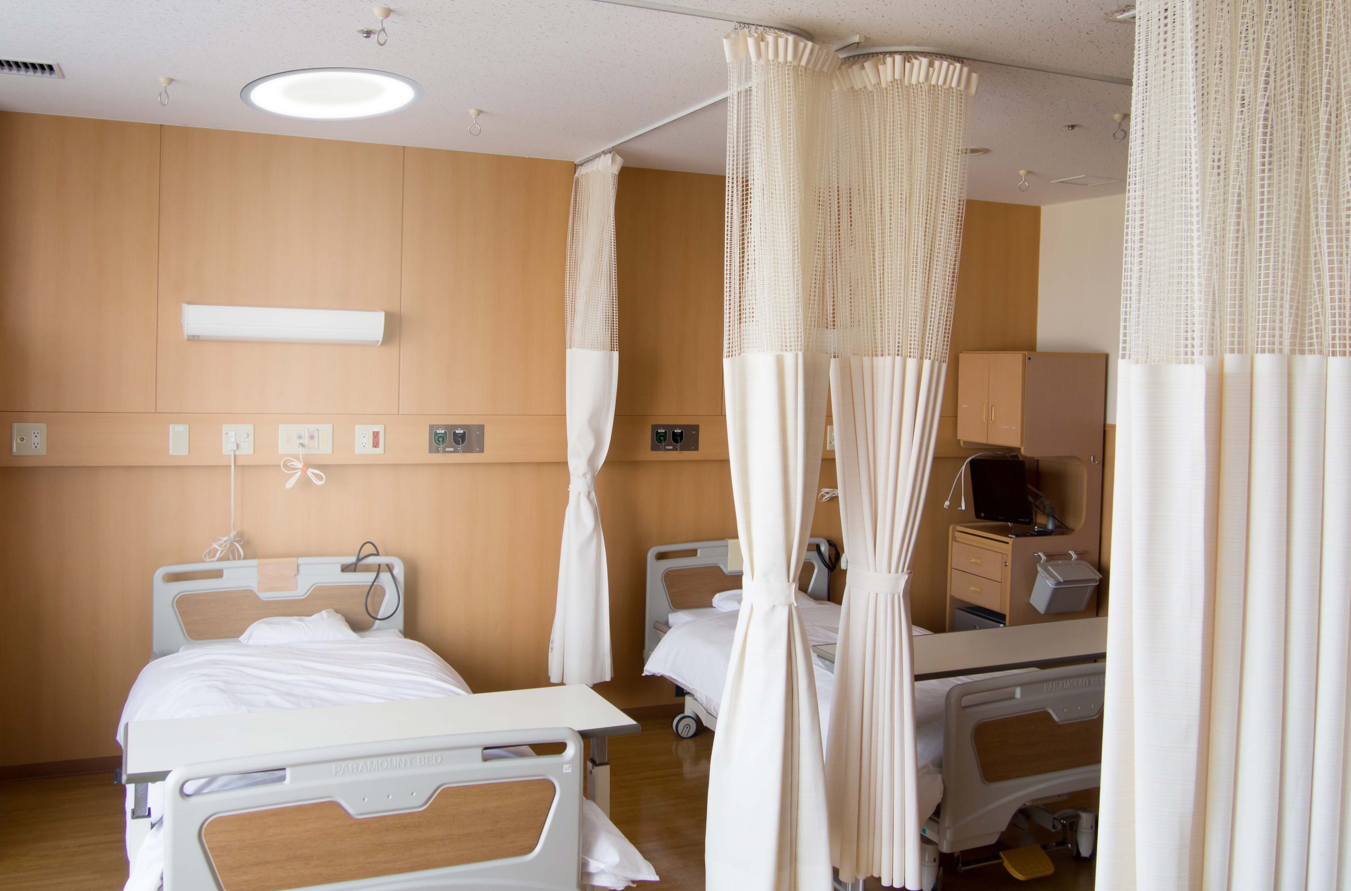 Symmetry patient room lighting fixture over a patient bed