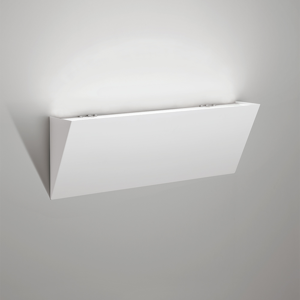A sharp, angled indirect wall sconce with a solid body