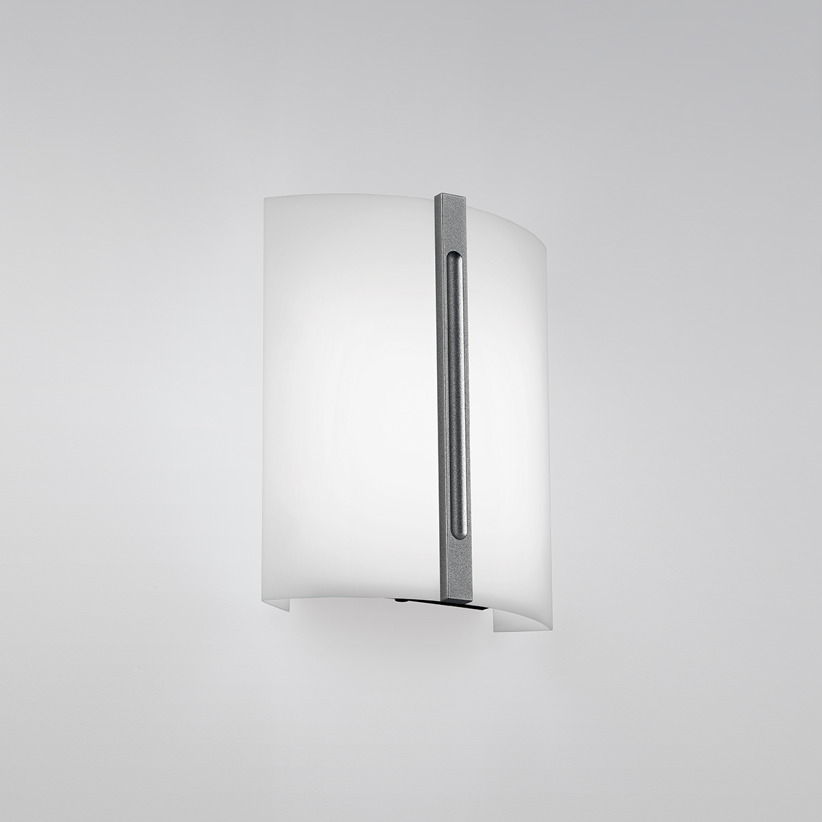 A small luminous wall sconce with a metal accent bar in the center