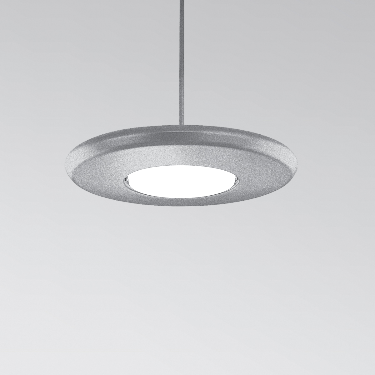 CP4452 Aries A round, disc-shaped pendant with a luminous downlight diffuser in the center