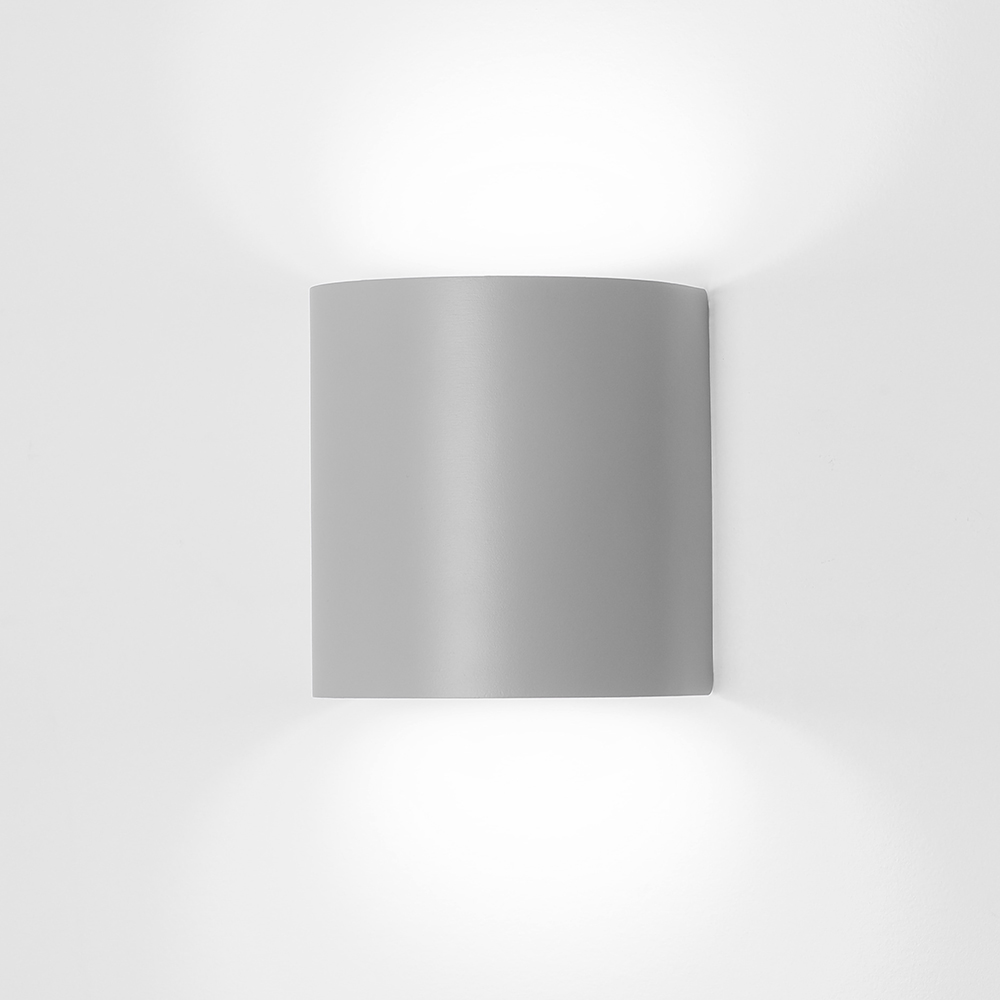 Naya is a smooth semi-cylinder shaped ADA healthcare sconce.