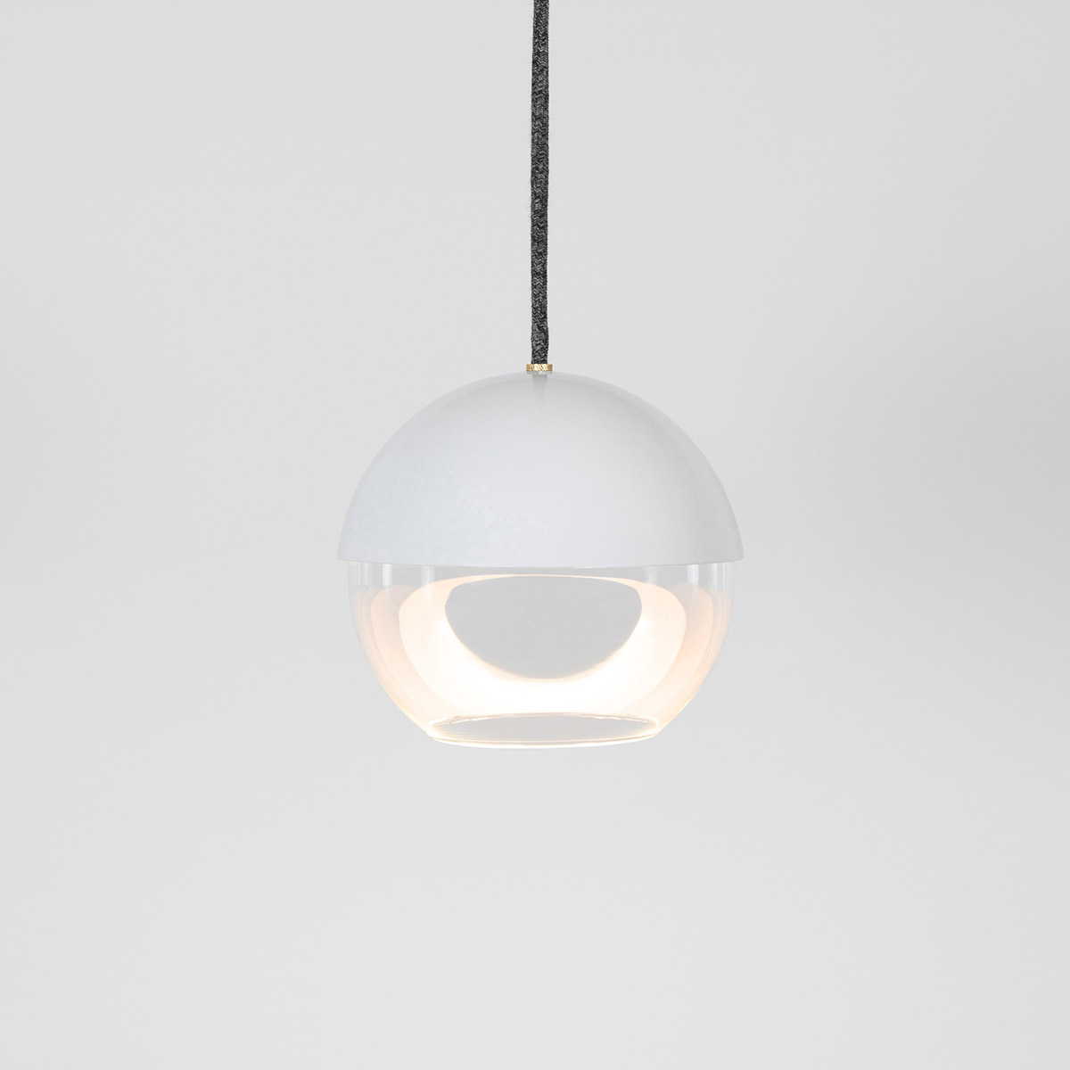 The 8” Muse pendant light globe utilizes a source disk that floats while reflecting indirect light.