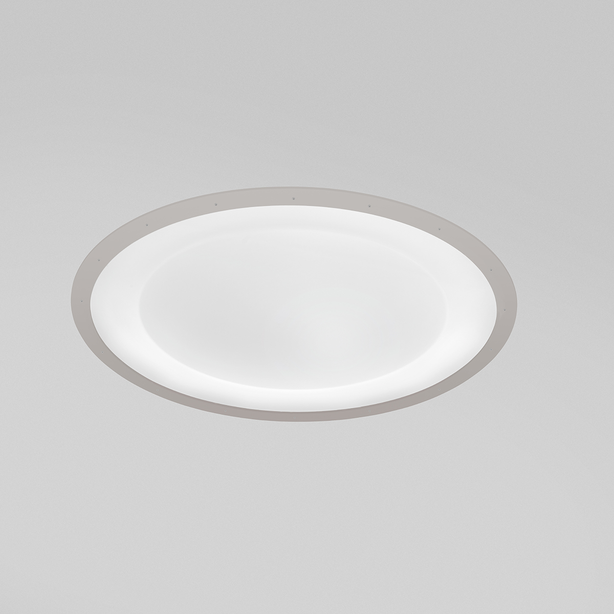 A round, recessed ceiling luminaire with a concave dome lens