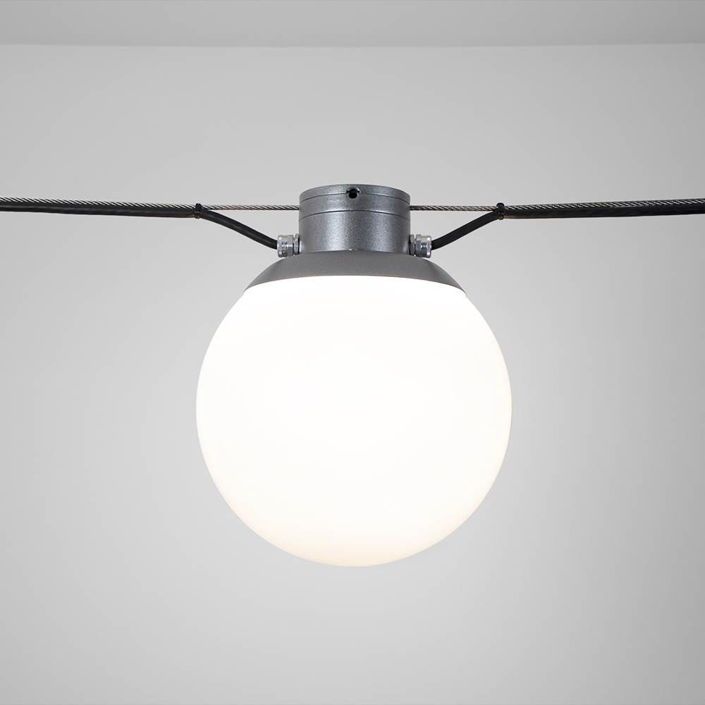 Globe-shaped outdoor pendant with a short metal cap with canopy suspension