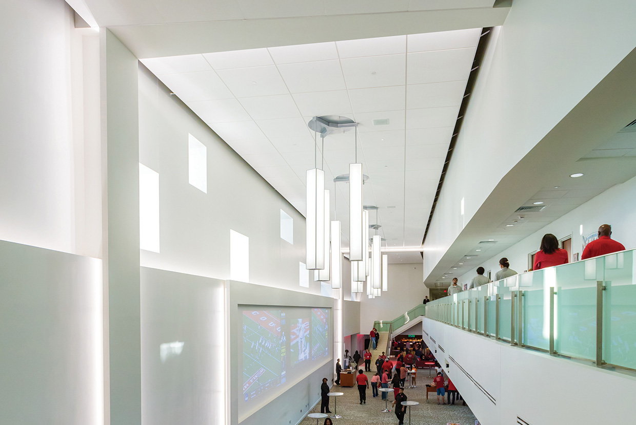 Parallel pendants in an education lighting application, mounted above a large campus sports arena lobby. 