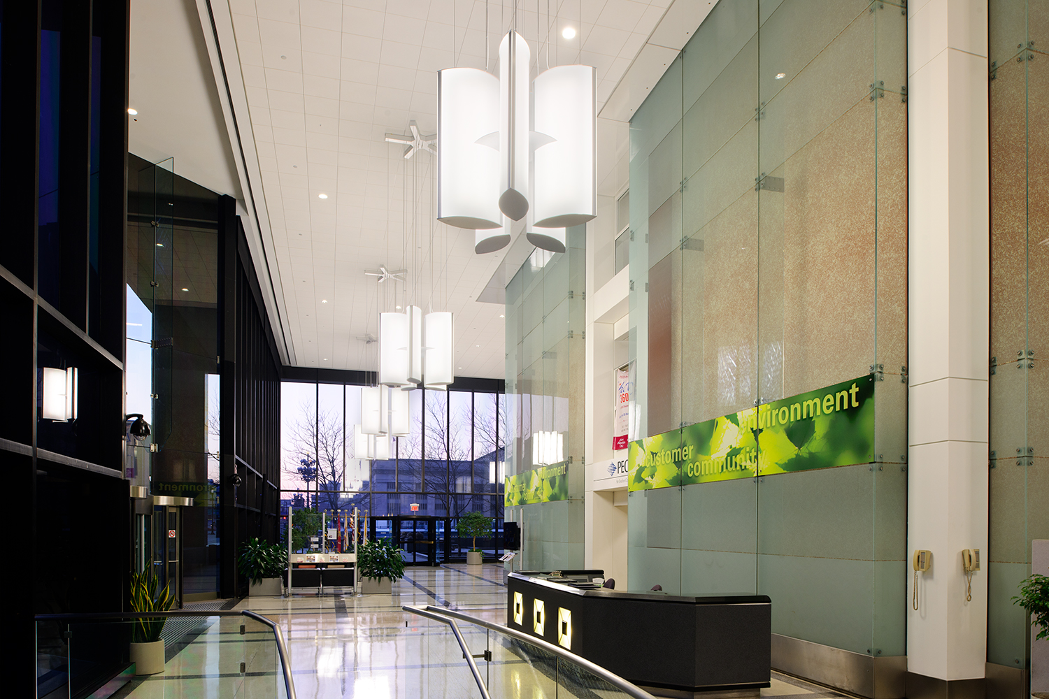 Air Foil pendants in a distinct lobby lighting design, grouped together in flower shapes.