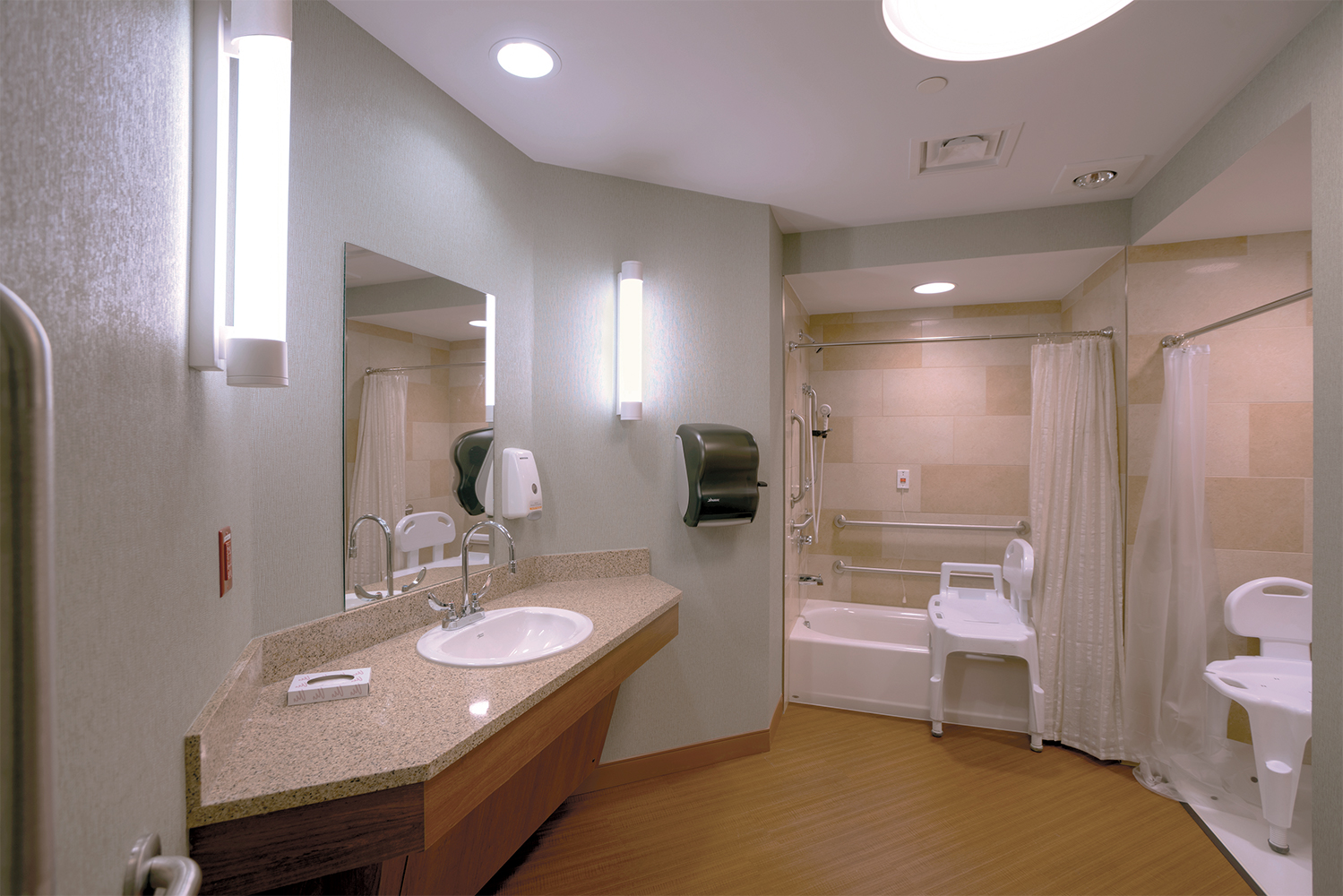 Asta modern vanity light fixtures provide accurate, stylish light for a nursing center bathroom.