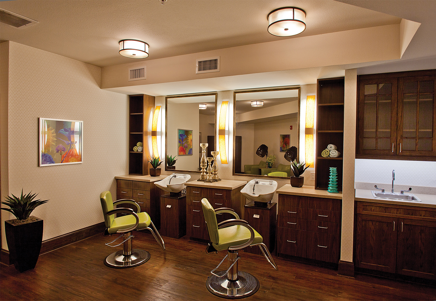 Bowe as a pleasing modern vanity light fixture, mounted vertically between salon mirrors, with Capitol ceiling luminaires.