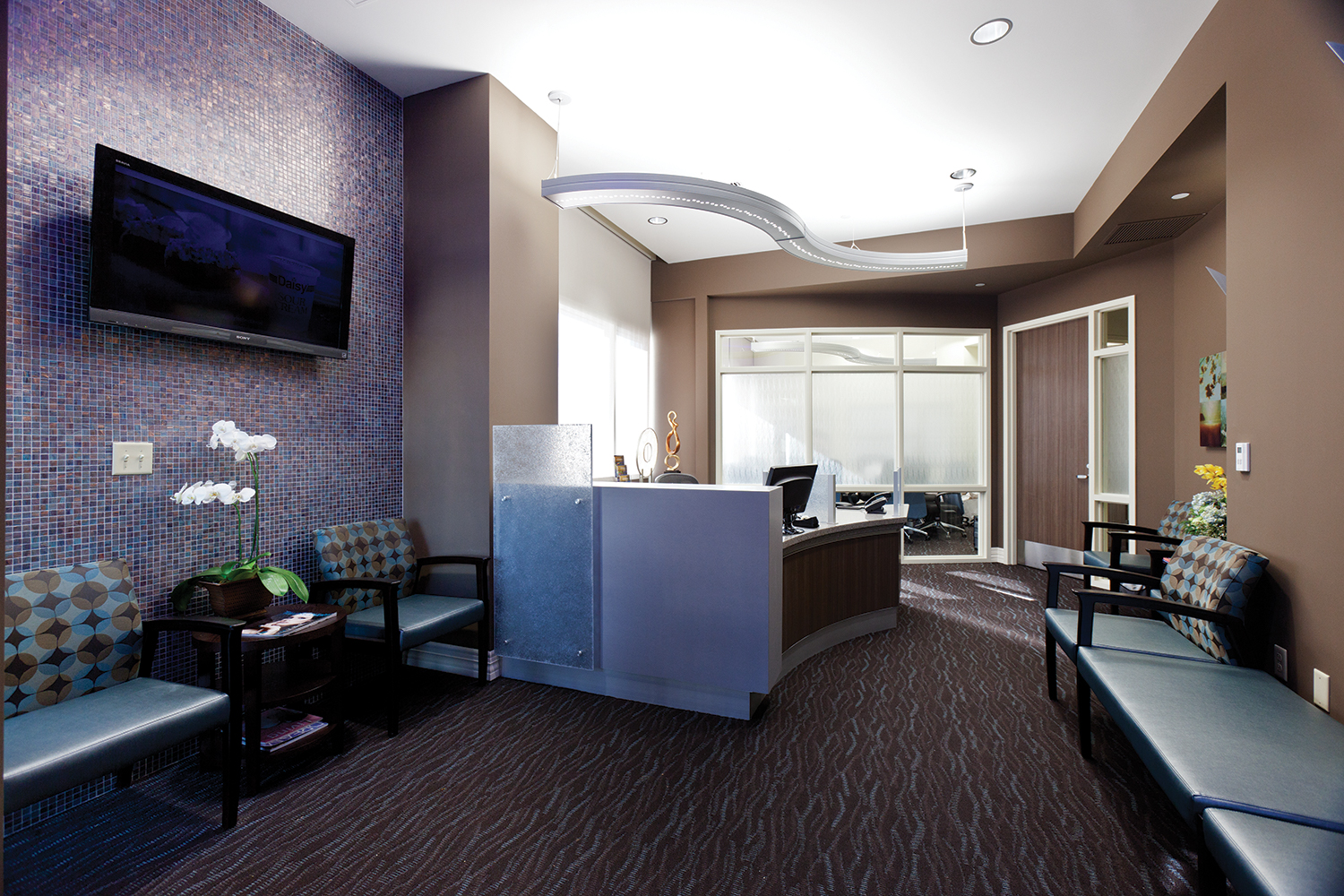 Infinity Performance in healthcare design above clinic reception desk.