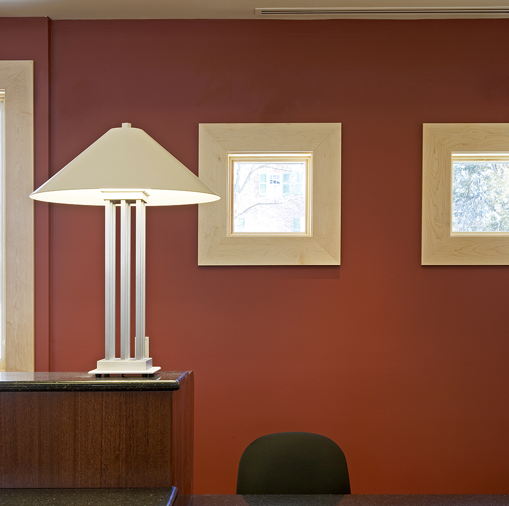 South Bay portable lamps serve as office lighting fixtures on a counter near a desk.