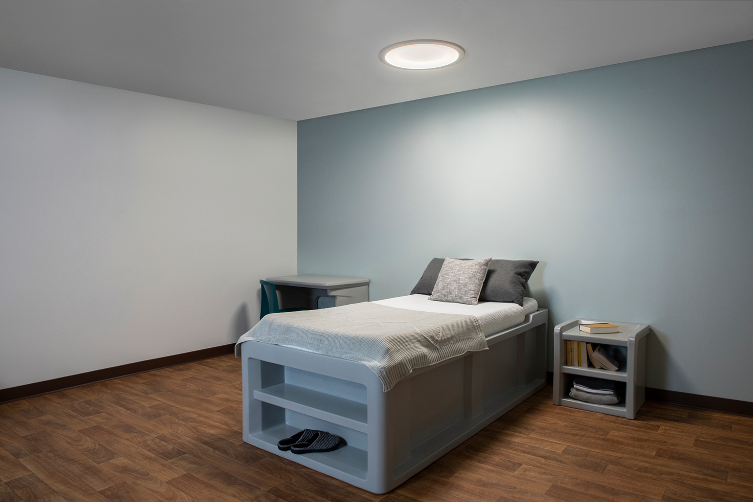 Symmetry behavioral health luminaire in a patient bedroom