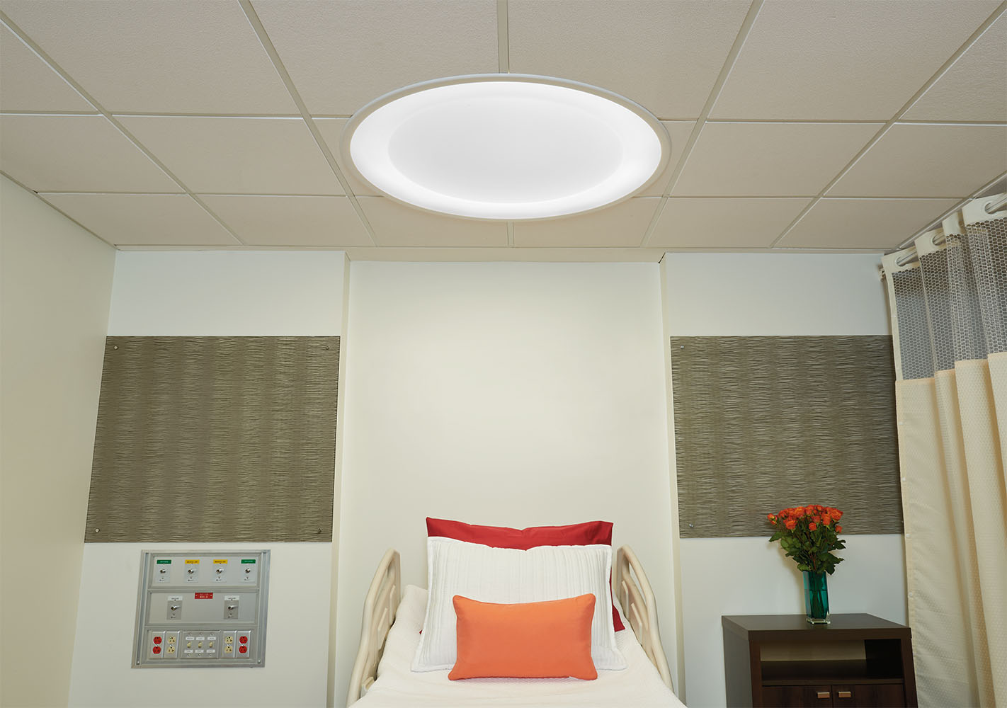 Symmetry patient room lighting fixture over a patient bed.
