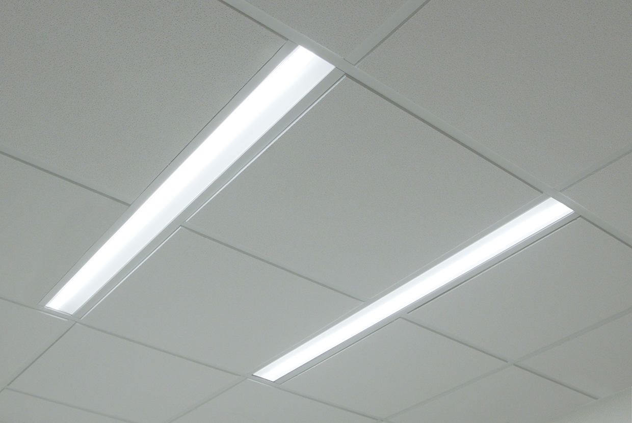 A thin dual unity overbed luminaire for patient lighting
