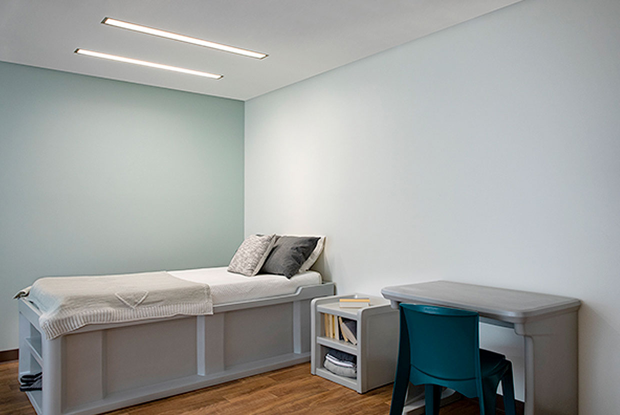 Lenga Overbed Lights Above a Bed in a Room